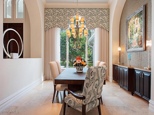 dining area with crown molding and a notable chandelier