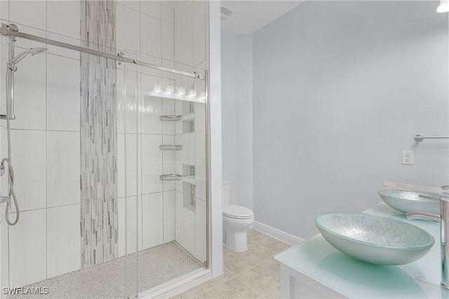 bathroom featuring walk in shower, vanity, and toilet