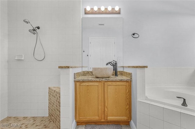 bathroom with shower with separate bathtub and sink