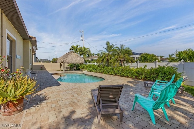 view of swimming pool with a gazebo and a patio