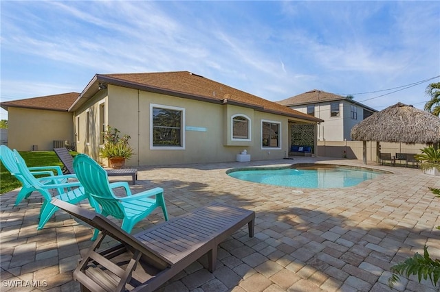 view of pool with a patio and a gazebo