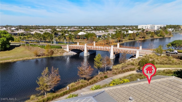 birds eye view of property featuring a residential view and a water view