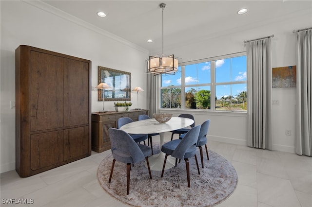 dining space with crown molding, recessed lighting, baseboards, and a chandelier