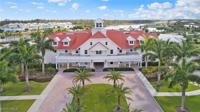 birds eye view of property with a residential view and a water view