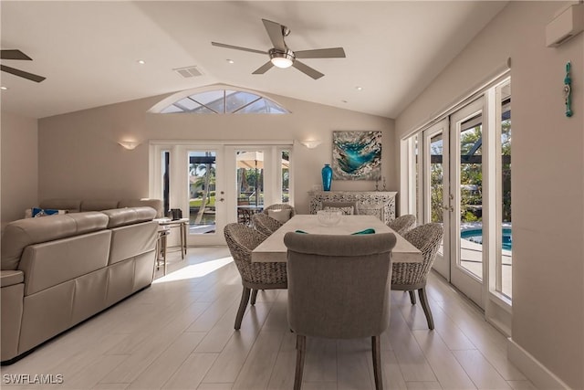 dining space with lofted ceiling, ceiling fan, french doors, and a healthy amount of sunlight