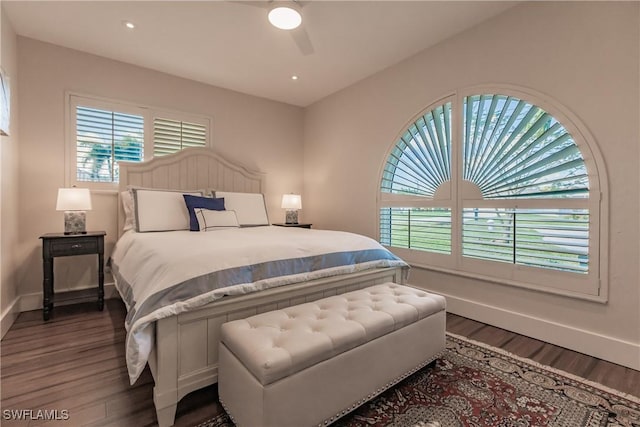 bedroom with ceiling fan and dark wood-type flooring