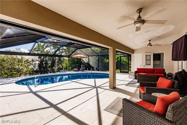 view of swimming pool featuring a patio area, an outdoor living space, ceiling fan, and a lanai