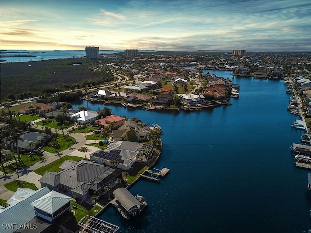 aerial view at dusk with a water view