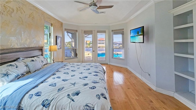 bedroom with crown molding, access to outside, light hardwood / wood-style floors, and ceiling fan