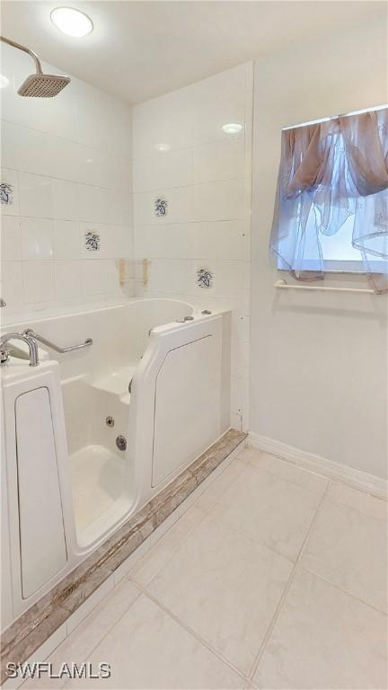 bathroom with shower / bathing tub combination and tile patterned floors