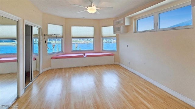 interior space featuring ceiling fan and light wood-type flooring