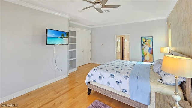 bedroom featuring ornamental molding, hardwood / wood-style floors, and ceiling fan