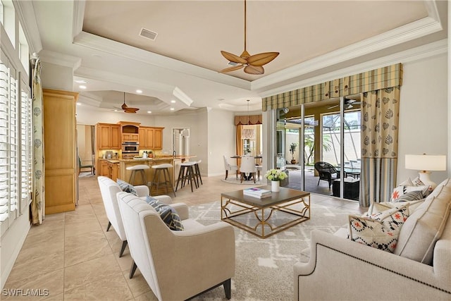 9411 Monteverdi Way, Fort Myers, FL 33912 - living area with a ceiling fan, a tray ceiling, crown molding, light tile patterned floors, and recessed lighting