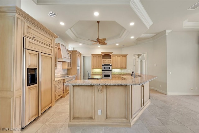 9411 Monteverdi Way, Fort Myers, FL 33912 - kitchen with custom exhaust hood, paneled refrigerator, recessed lighting, a ceiling fan, and light brown cabinets
