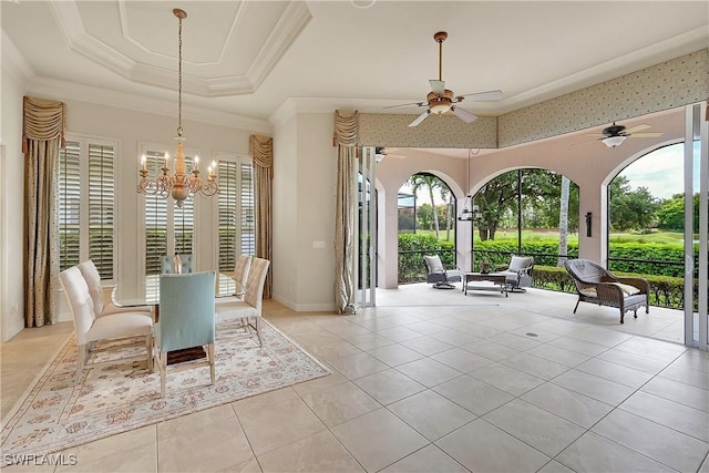 9411 Monteverdi Way, Fort Myers, FL 33912 - dining space with plenty of natural light, a tray ceiling, a chandelier, ceiling fan, and crown molding