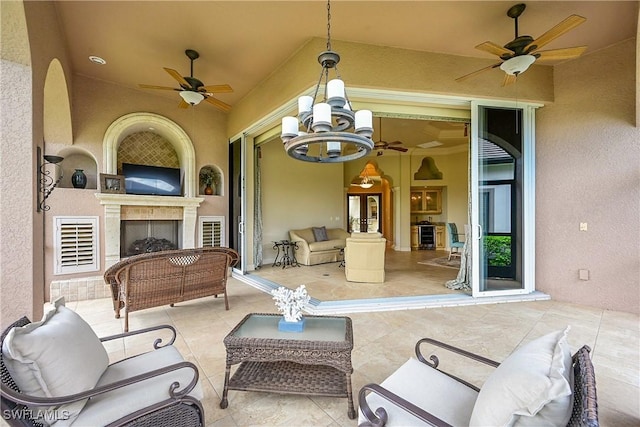 9411 Monteverdi Way, Fort Myers, FL 33912 - view of patio featuring a ceiling fan and an outdoor living space with a fireplace