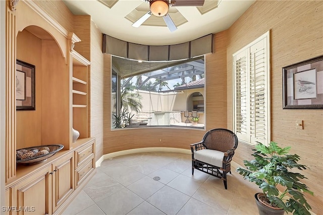 9411 Monteverdi Way, Fort Myers, FL 33912 - sitting room featuring light tile patterned flooring, a ceiling fan, and baseboards