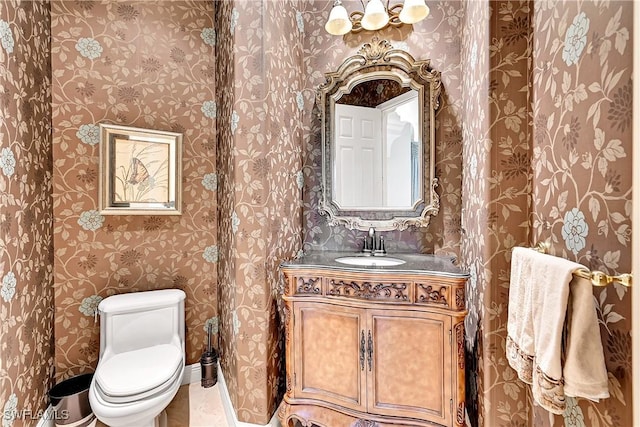 9411 Monteverdi Way, Fort Myers, FL 33912 - bathroom with wallpapered walls, toilet, and vanity