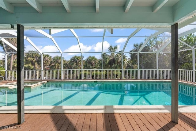 view of swimming pool with glass enclosure