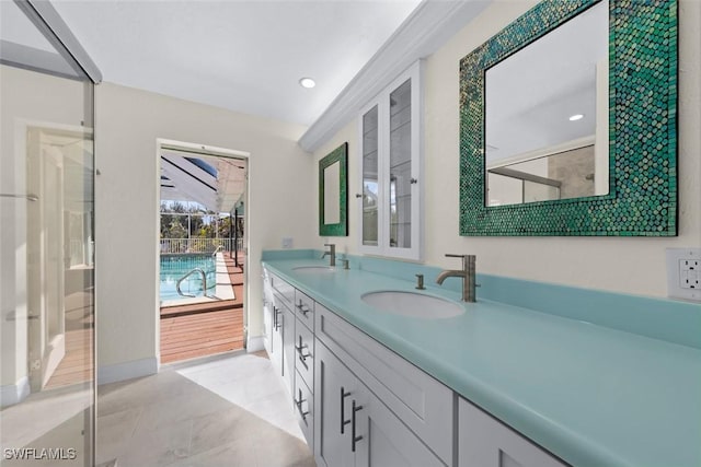 bathroom featuring vanity and a shower with shower door