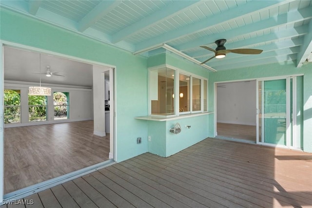 wooden deck featuring ceiling fan