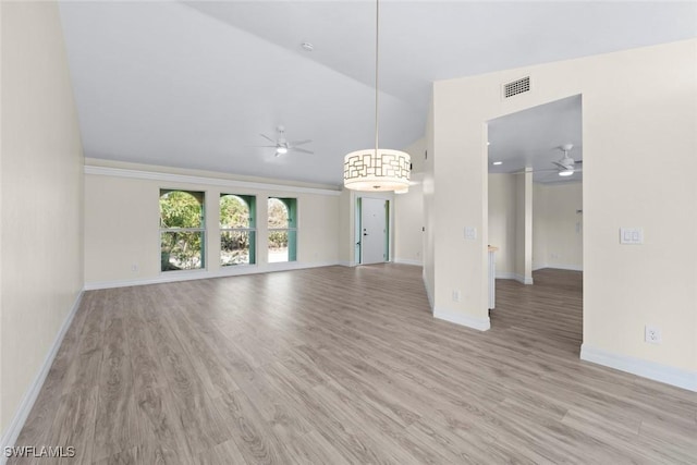 unfurnished living room with vaulted ceiling, ceiling fan, and light wood-type flooring