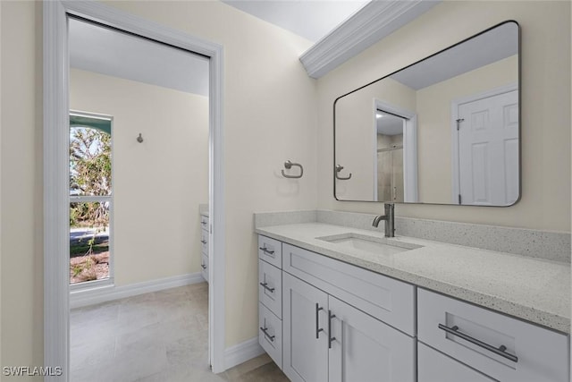 bathroom featuring plenty of natural light and vanity