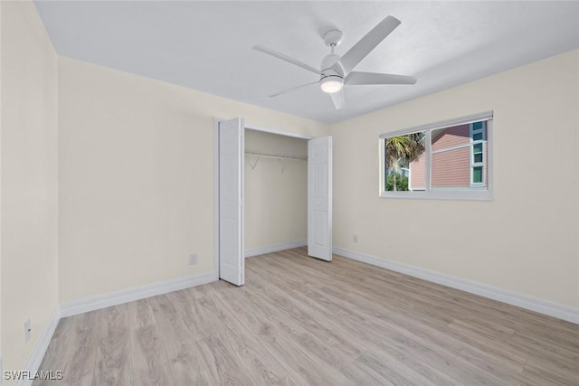 unfurnished bedroom with ceiling fan, a closet, and light hardwood / wood-style flooring