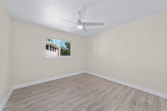 empty room featuring ceiling fan and light hardwood / wood-style flooring