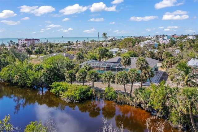 birds eye view of property with a water view