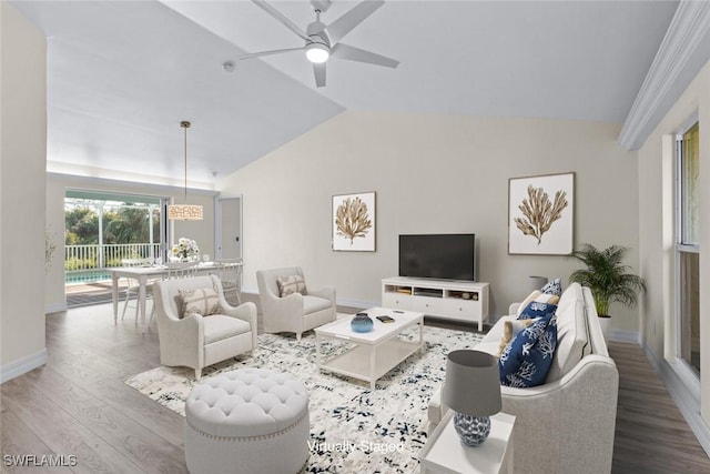 living room featuring lofted ceiling, hardwood / wood-style flooring, and ceiling fan