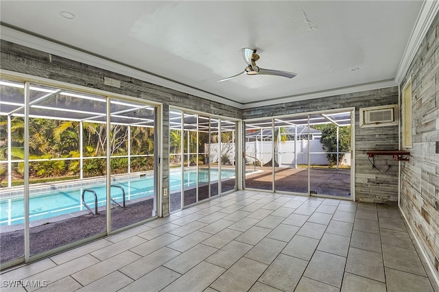 unfurnished sunroom with a wall mounted AC and ceiling fan