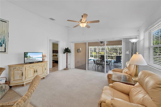 living room with ceiling fan and light carpet