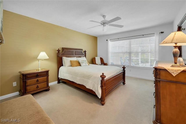 bedroom with light carpet and ceiling fan