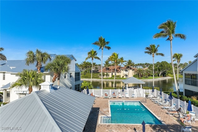 view of swimming pool with a gazebo, a patio area, and a water view