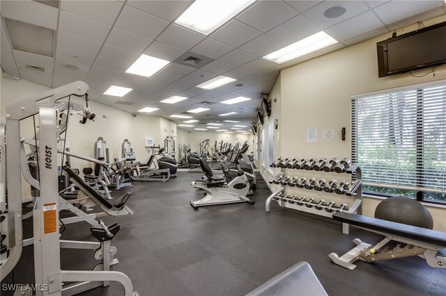 exercise room featuring a paneled ceiling