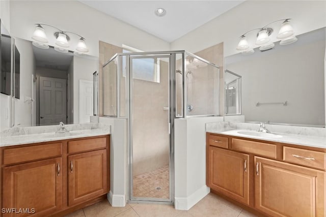 bathroom featuring vanity, an enclosed shower, and tile patterned flooring