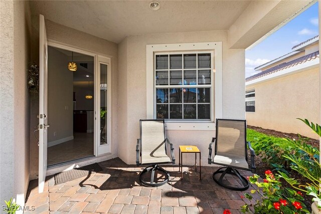 doorway to property featuring a patio area