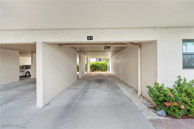 garage featuring a carport