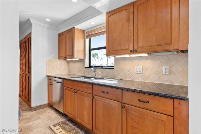 kitchen featuring sink, dark stone countertops, stainless steel dishwasher, ornamental molding, and backsplash