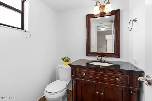 bathroom with vanity and toilet