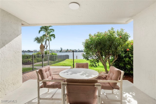 view of patio / terrace with a water view