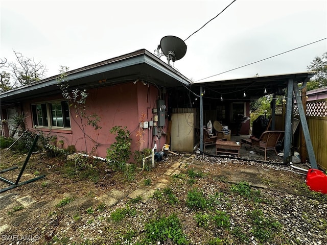 view of side of property with a patio