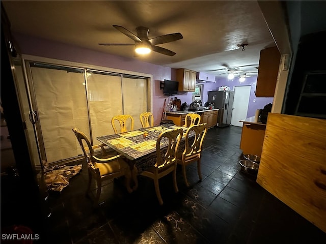 dining space with ceiling fan