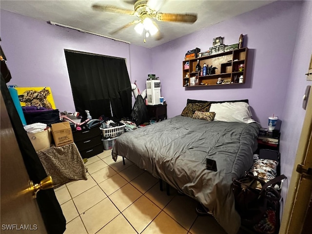 bedroom with light tile patterned floors and ceiling fan