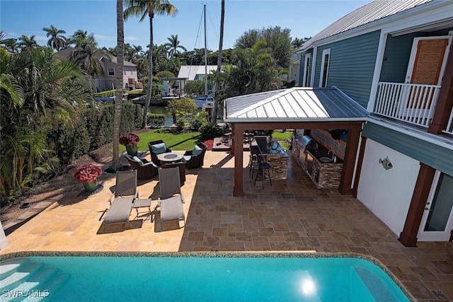 view of pool featuring a gazebo, an outdoor living space, and a patio