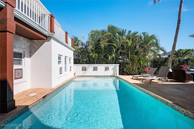 view of swimming pool with a patio area