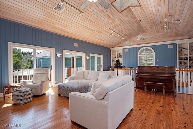 living room featuring hardwood / wood-style flooring, ceiling fan, wood ceiling, and vaulted ceiling