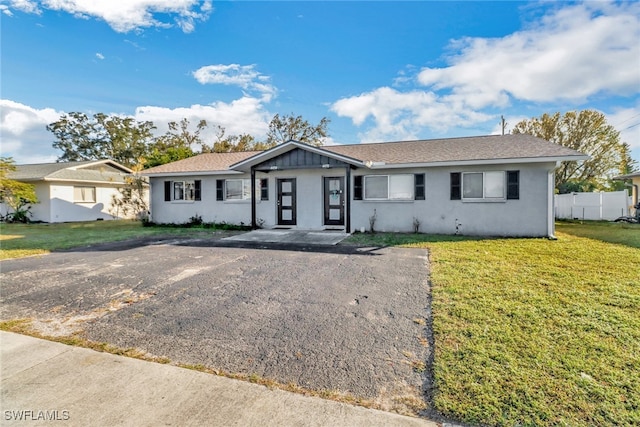 ranch-style home with a front yard