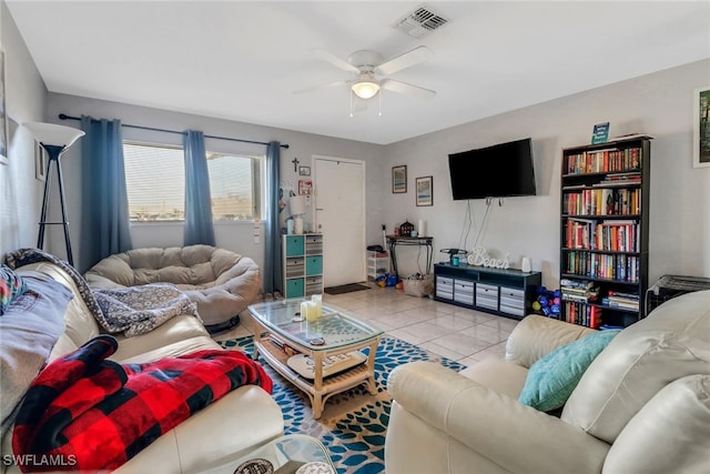 tiled living room with ceiling fan